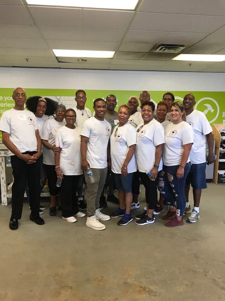 Edmond family members in matching volunteer shirts at the Habitat for Humanity ReStore in Richmond, Virginia during the 2019 Family Reunion